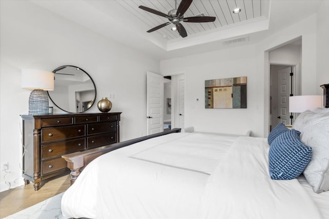 bedroom featuring visible vents, a raised ceiling, wooden ceiling, wood finished floors, and recessed lighting