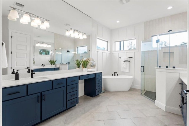 full bathroom featuring visible vents, a soaking tub, tile patterned floors, vanity, and a shower stall