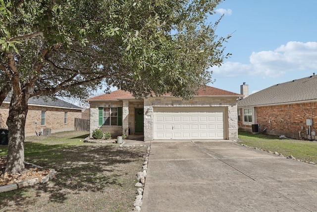 ranch-style house featuring an attached garage, concrete driveway, stone siding, and cooling unit