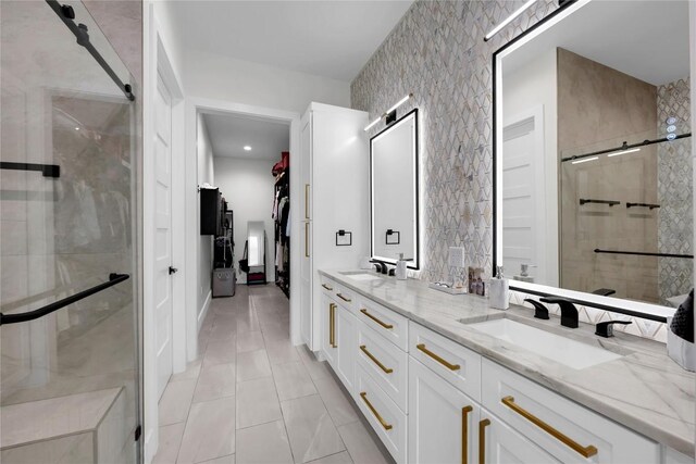 711 Twin Sails, Horseshoe Bay, TX 78657 - bathroom featuring double vanity, a sink, and a shower stall
