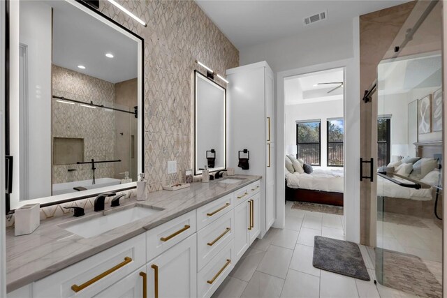 711 Twin Sails, Horseshoe Bay, TX 78657 - full bathroom with visible vents, a sink, a shower stall, and ensuite bathroom