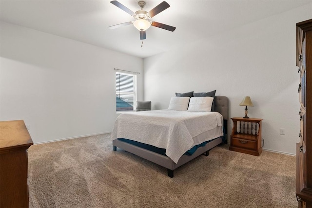 bedroom with ceiling fan and carpet flooring