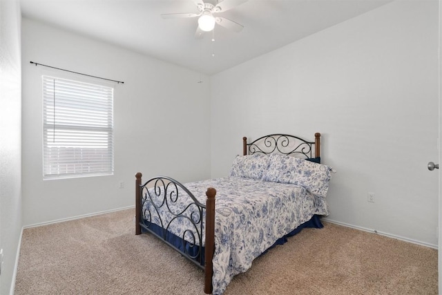 bedroom with carpet floors, ceiling fan, and baseboards