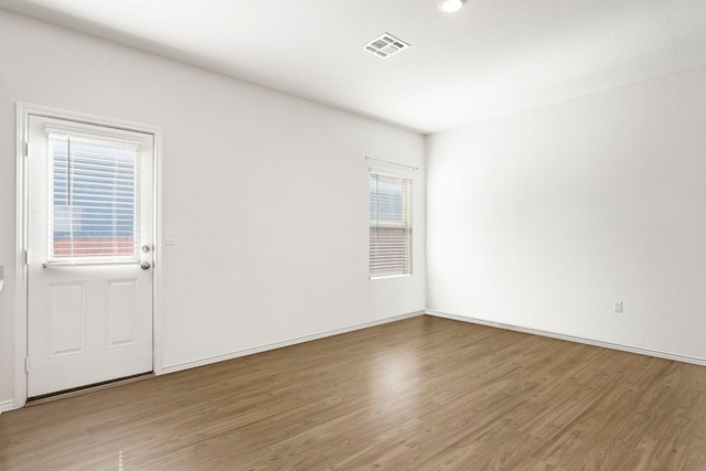 7016 Spirit Hill Rd, Austin, TX 78744 - empty room featuring wood finished floors and baseboards