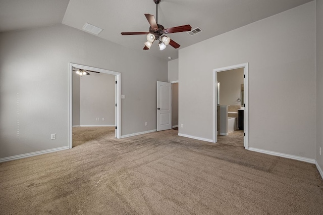 unfurnished bedroom featuring lofted ceiling, baseboards, visible vents, and carpet flooring