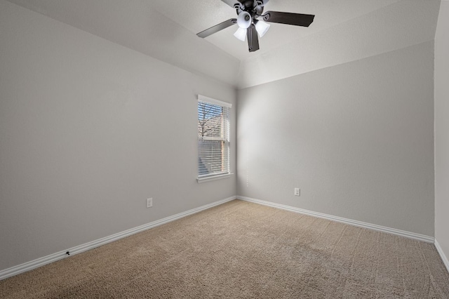 empty room featuring a ceiling fan, lofted ceiling, light carpet, and baseboards