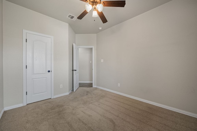 unfurnished bedroom featuring a ceiling fan, baseboards, visible vents, and carpet flooring