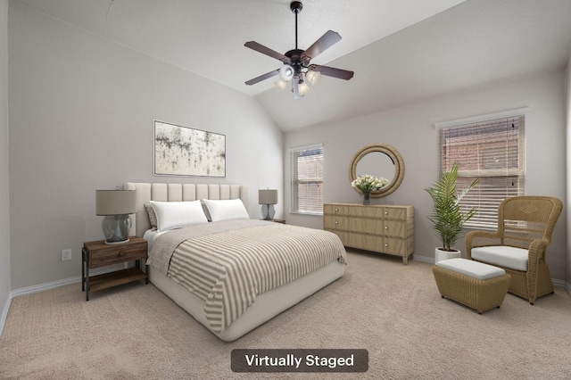 carpeted bedroom with vaulted ceiling, ceiling fan, and baseboards