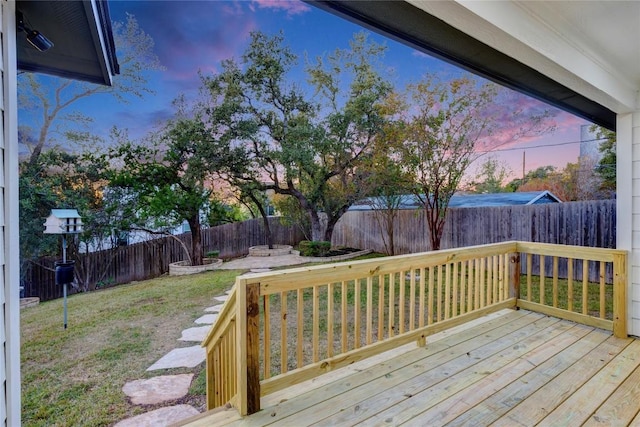 deck featuring a fenced backyard and a yard