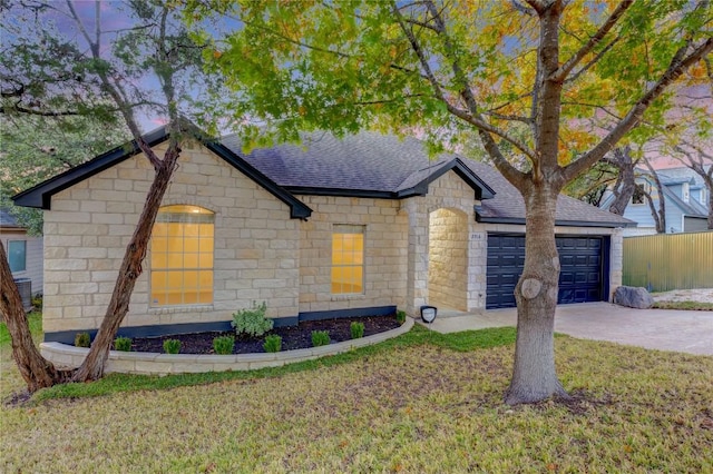 2916 Chisholm Trl, Austin, TX 78734 - view of front of house with a shingled roof, a garage, driveway, stone siding, and cooling unit