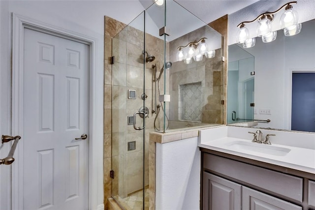 full bath featuring a shower stall and vanity