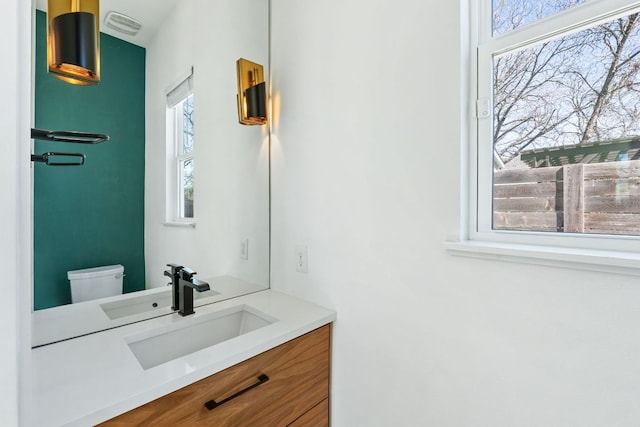 bathroom with vanity and toilet