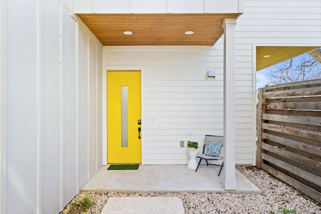 doorway to property with fence