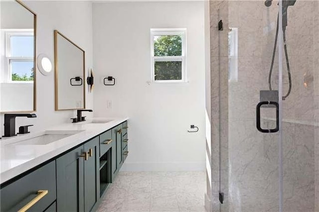 bathroom featuring double vanity, a sink, and a shower stall