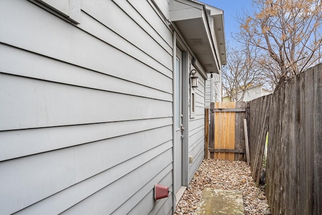 view of home's exterior featuring fence