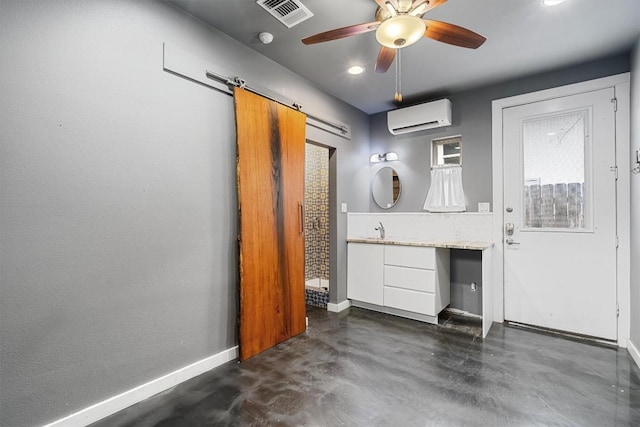 bathroom with ceiling fan, visible vents, baseboards, an AC wall unit, and finished concrete floors