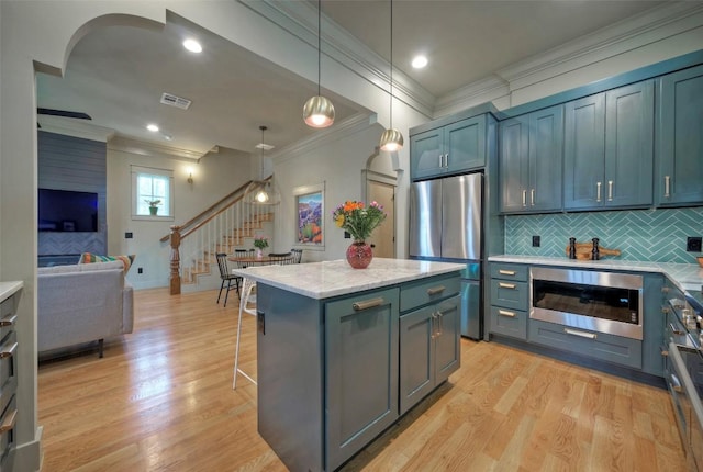 kitchen with wall oven, freestanding refrigerator, visible vents, and light wood finished floors