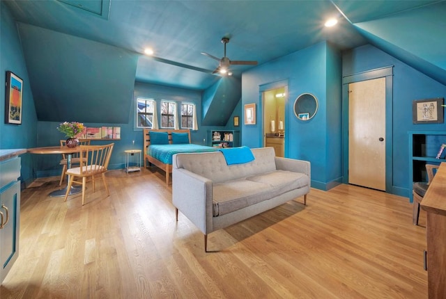 bedroom featuring light wood-style floors, baseboards, vaulted ceiling, and recessed lighting