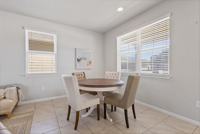 dining area featuring light tile patterned floors, recessed lighting, plenty of natural light, and baseboards