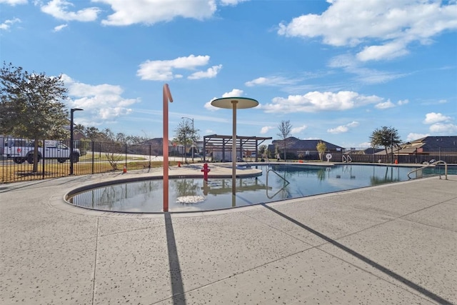 community pool featuring fence