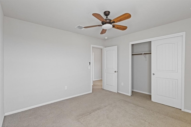 unfurnished bedroom featuring carpet, visible vents, baseboards, and a closet