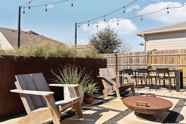 view of patio / terrace featuring fence