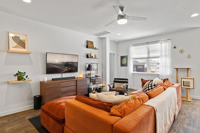 living room featuring recessed lighting, visible vents, baseboards, and wood finished floors