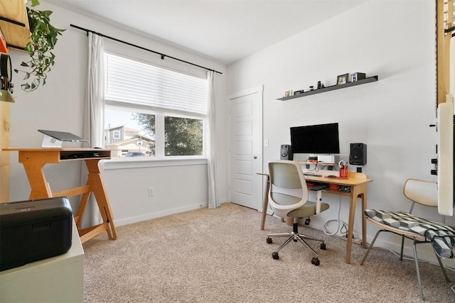 home office featuring carpet flooring and baseboards