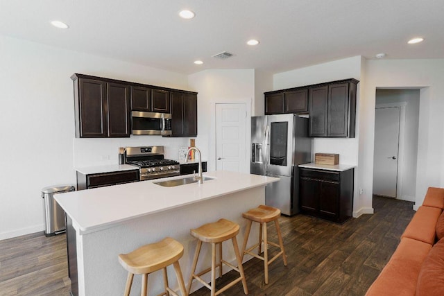 4709 Oxgang Dr, Pflugerville, TX 78660 - kitchen with dark wood-style flooring, a sink, visible vents, and stainless steel appliances