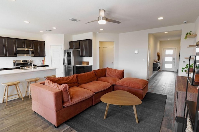 4709 Oxgang Dr, Pflugerville, TX 78660 - living area with wood finished floors, a ceiling fan, visible vents, and recessed lighting