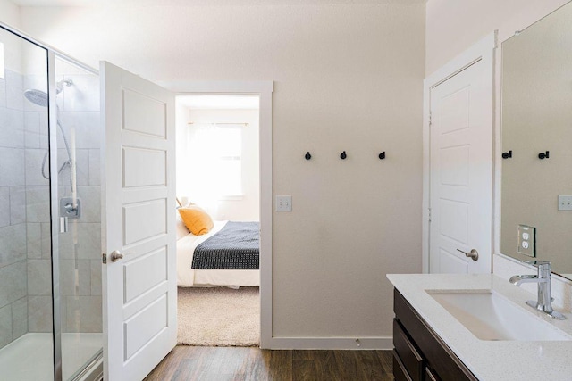 4709 Oxgang Dr, Pflugerville, TX 78660 - bathroom with a shower stall, ensuite bath, wood finished floors, and vanity