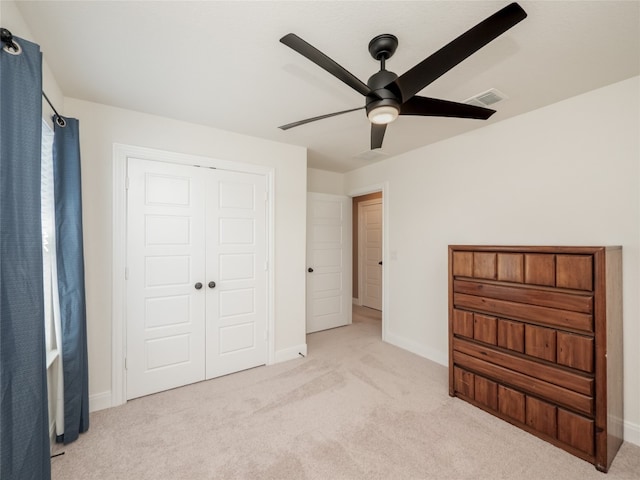 unfurnished bedroom featuring carpet flooring, visible vents, and baseboards