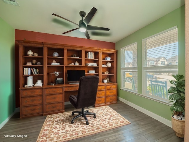 office area featuring a ceiling fan, wood finished floors, visible vents, and baseboards