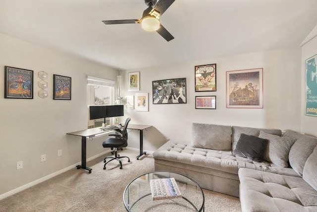 home office with a ceiling fan, carpet, and baseboards