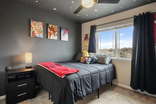 bedroom with carpet, baseboards, and ceiling fan