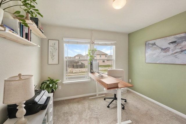 home office featuring carpet and baseboards