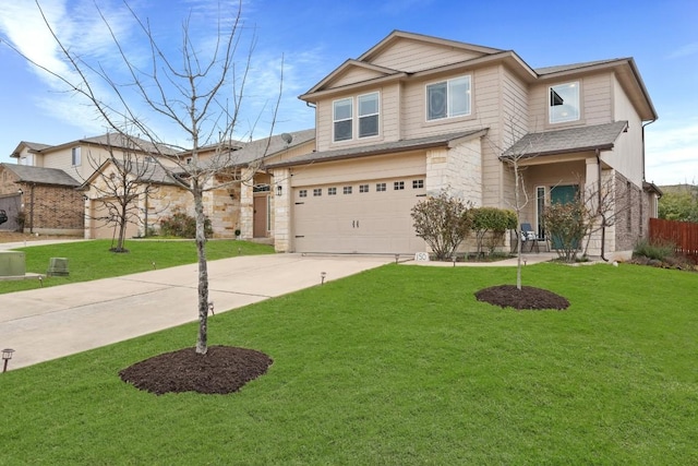 view of front of home with driveway, an attached garage, fence, and a front lawn