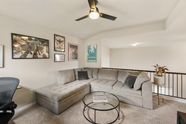 living area featuring lofted ceiling, carpet floors, a ceiling fan, and baseboards