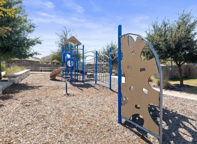 community jungle gym featuring fence