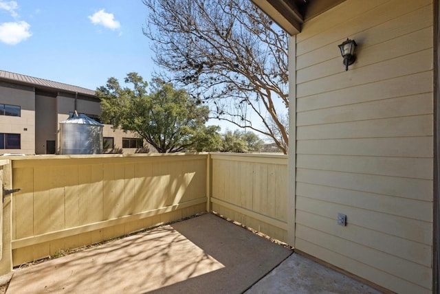 view of patio / terrace featuring fence