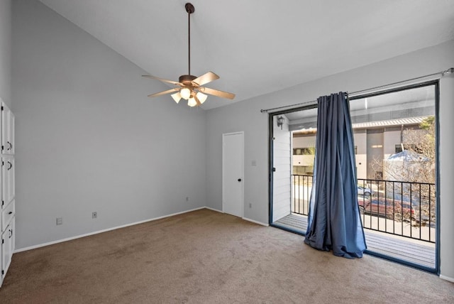 empty room featuring baseboards, a ceiling fan, vaulted ceiling, and carpet flooring