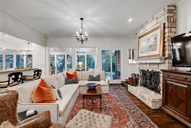 2405 Westlake Pass, Austin, TX 78746 - living area with a chandelier, dark wood-type flooring, ornamental molding, recessed lighting, and a stone fireplace