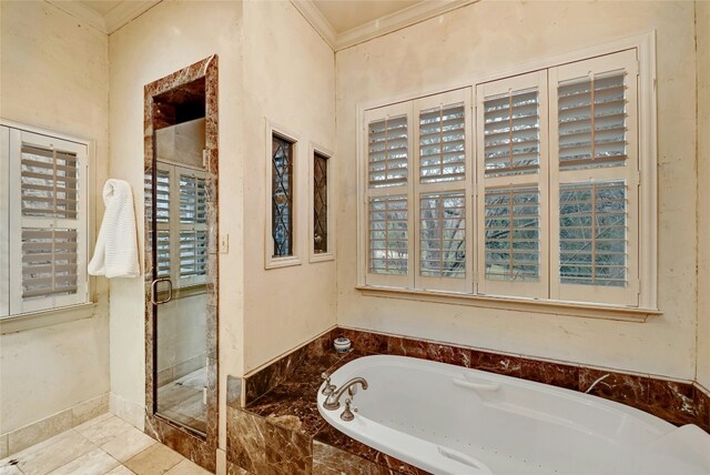 full bathroom with a shower stall, crown molding, and a bath
