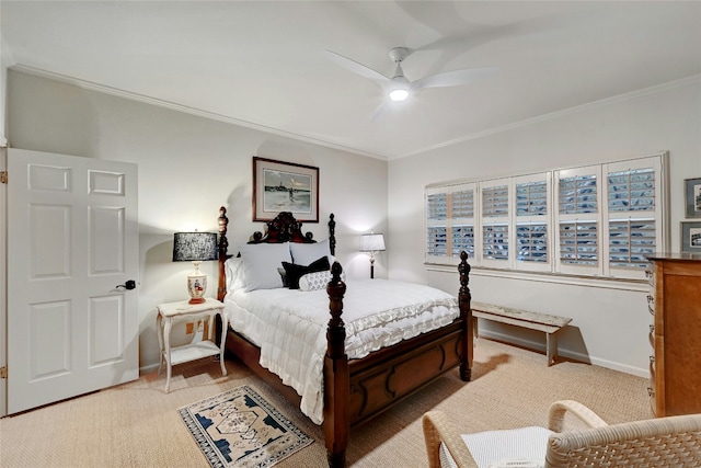 carpeted bedroom with ornamental molding, baseboards, and a ceiling fan