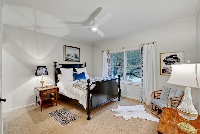 bedroom featuring a ceiling fan, baseboards, ornamental molding, and carpet flooring