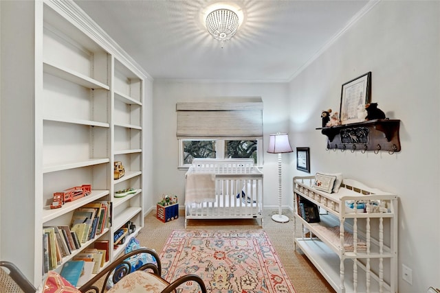 bedroom with carpet floors, crown molding, and baseboards