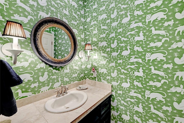 bathroom with wallpapered walls and vanity