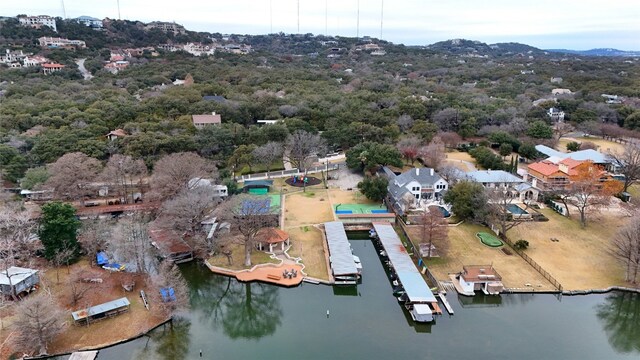 birds eye view of property with a water and mountain view