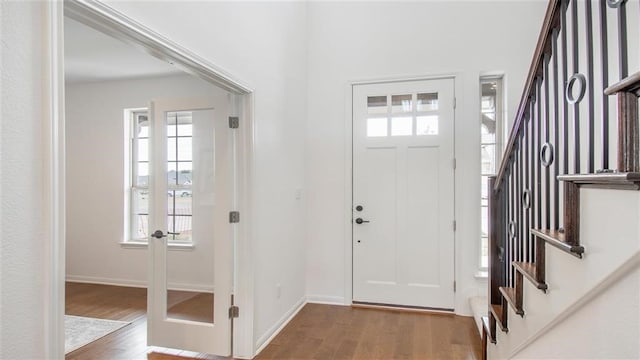 112 Amber Oak Ln, Georgetown, TX 78628 - foyer entrance featuring wood finished floors, stairs, and baseboards