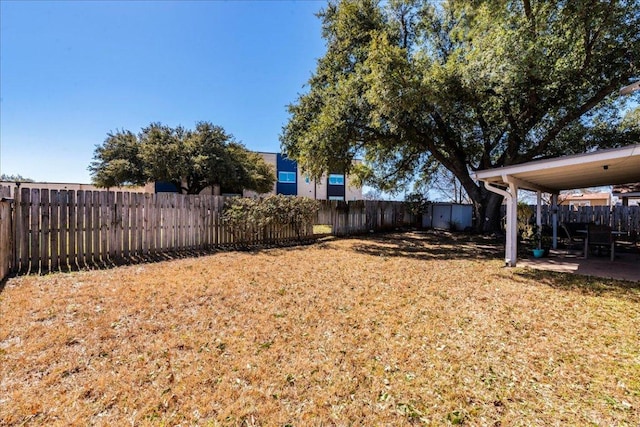 view of yard featuring a patio and a fenced backyard